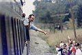 George H. W. Bush waves to spectators along the route of his 1992 reelection campaign whistle-stop tour of Ohio