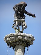 Saint-Jean-du-Doigt : fontaine monumentale (1691), Dieu le Père bénissant le baptême de son Fils.