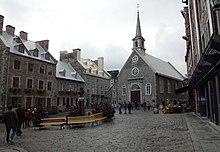 View of the Place Royale in Quebec City, with the facade of the Notre-Dame-des-Victoires church.