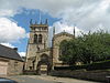 A church with a tower separate from the body of the church, joined by an archway