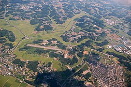 A view of the east part of Ami Town. Ami Airfield on the left.