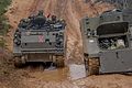 An M113 and an M577 A2 of the Mechanized Brigade (Portugal)