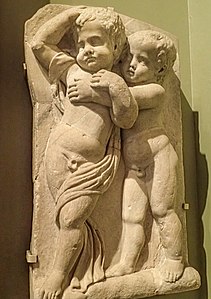 Fragment of a marble sarcophagus depicting two drunken boys from a Bacchic revel, made in Athens 140–150 CE
