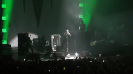 Marilyn Manson performing in 2017. Left to right: Paul Wiley, Tyler Bates, Manson, Daniel Fox, Twiggy, and Gil Sharone (obscured at the drums).