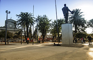 Tomás Berreta square with the monument to José Gervasio Artigas; in the background, the parish church of St. John the Baptist.