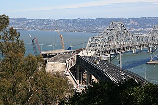September 29, 2009: New S-connector with traffic, white section replaced translated original segment to its left, remainder of original section is partially dismantled, to be replaced with a permanent transition structure to the new bridge. Viewpoint is near the U.S. Coast Guard harbor control center above the Yerba Buena tunnel.