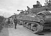 Convoy of Sherman Firefly tanks seen from behind