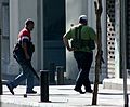 Armed Lebanese militiamen wearing locally produced Ephod Combat Vests running for cover near the Crown Plaza Hotel on the Hamra district in Beirut during the 2008 conflict in Lebanon.