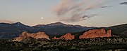 Garden of the Gods near sunrise, approaching the setting of the seasonal blue moon behind Pikes Peak, August 2021