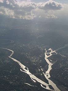 Aerial image showing two rivers meandering towards confluence near the bottom of the image