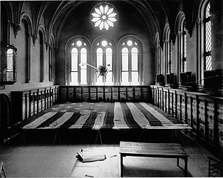 #42 (24/9/1877) The original Star-Spangled Banner flag undergoing restoration work in 1914 in the West Wing of the Smithsonian Institution Building, under the hanging giant squid model, one of the few exhibits not removed for the occasion (see also photograph showing seamstresses at work under the guidance of Amelia Fowler)