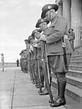 Australian guard of honour on Remembrance Day, 1943, resting on arms reversed