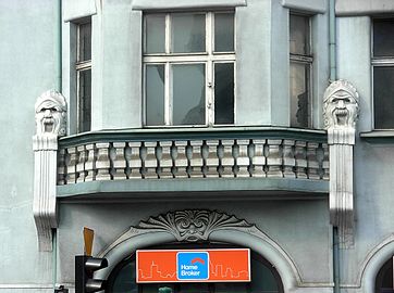 Masked faces on the facade