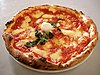 A traditional pizza napoletana, sometimes referred to as a "Margherita" in English.