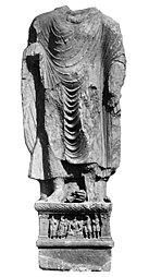 Kanishka I: Buddha from Loriyan Tangai with inscription mentioning the "year 318" of the Yavana era (AD 143).[125]