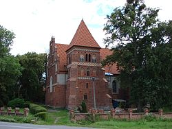 Parish church dedicated to Saints Cosmas and Damian. Built in mid-14th century.