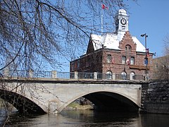 Pembroke Street Bridge crossing the Muskrat River, with City Hall in the background.