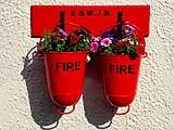 Round-bottomed fire buckets in Parkend, Gloucestershire. S.& W. J. R. stands for the Severn & Wye Joint Railway.