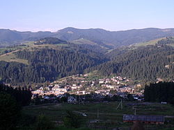 View of the town of Putyla and the Carpathian Mountains in the background.