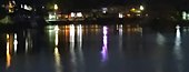 Reflections of the rowing clubs around the lake at night