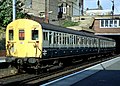 A Class 416 EMU in British Rail blue/grey livery calls at Dalston Kingsland