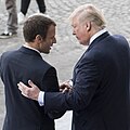Donald Trump and Emmanuel Macron shaking hands