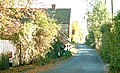 Former B2067 passing Court Farm in October 2003