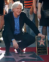 Cameron receiving a star on the Hollywood Walk of Fame in December 2009