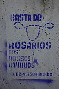 Feminist graffiti in A Coruña, Spain, that reads Enough with rosaries in our ovaries