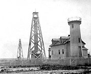 Nantucket Harbor Range Lights with 1856 Brant Point Tower to the right U.S. Coast Guard photo