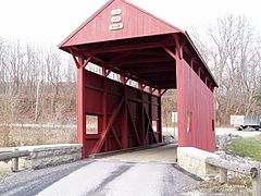 Interior structure of a covered bridge that uses a queen-post structure