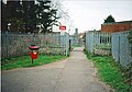 Tubbs Crossing in the west of Bicester on the Varsity Line in 2010. It is due to be turned in to a bridge very soon for safety reasons. The line is only used by the odd refuse train, spare stock movement and maintenance unit. It links Bicester with Aylesbury via Calvert Refuse Tip. The hedges were cut back in circa 2004 after an adult fell over and did not notice a refuse train was coming leading up to the Christmas of 2002 and a teenager was accidently pushed under a maintenance train in 1999. The adult was hurt and the teen died.