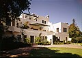 HABS photograph of the Lou Henry and Herbert Hoover House, a large pueblo-style building surrounded by trees and plantings.