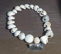 Image 1A necklace reconstructed from perforated sea snail shells from Upper Palaeolithic Europe, dated between 39,000 and 25,000 BCE. The practice of body adornment is associated with the emergence of behavioral modernity. (from Nudity)