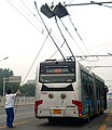 Image 262On this articulated Beijing trolleybus, the operator uses ropes to guide the trolley poles to contact the overhead wires. (from Trolleybus)