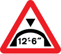 Warning of maximum headroom of arch bridge directly ahead (imperial)