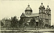 An old looking picture of a large church