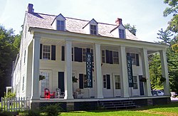 Front view of Brookside with colonnade at entranceway