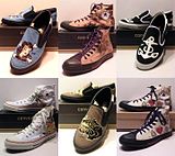 A line of Converse shoes depicting some of Sailor Jerry's original tattoo artwork