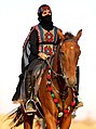 Image 2A Saudi woman riding a horse at Souk Okaz, a yearly cultural festival in the outskirts of Taif (from Culture of Saudi Arabia)