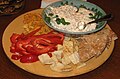 A clam dip with various dipping foods