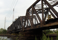 The Baltimore and Ohio Railroad Bridge, built in the late 19th or early 20th century as a two track, swing bridge across the Schuylkill River in the Grays Ferry neighborhood in Philadelphia, Pennsylvania. Now a CSX Philadelphia Subdivision bridge. View from the west river bank, looking northeast.