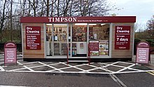 Timpson pod store stood in an outdoor supermarket car park