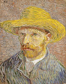 A mid to late 30s man gazing to the left with a green coat, gray tie and wearing a straw hat