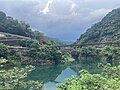 Wulai Suspension Bridge over Nanshi River with incoming storm