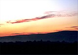 Zalazak sunca nad Pleternicom s pogledom na Požešku goru.