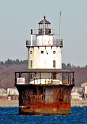 Butler Flats Light stands in open water about 15 feet (4.6 m) deep, about 1,800 feet (550 m) from land