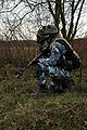 A sniper from the French CENZUB opposing force wearing a blue-and-gray version of Camouflage Central-Europe.