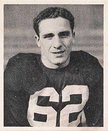 Charley Trippi wearing a Chicago Cardinals jersey. Shown from the waist up with no helmet.