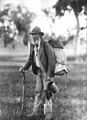 Image 33A swagman in bushman's apparel, wearing a brimmed hat and carrying swag and billy can (from Culture of Australia)